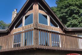 wooden cabin home with window tint film