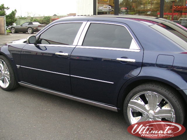 navy sedan with windows tinted