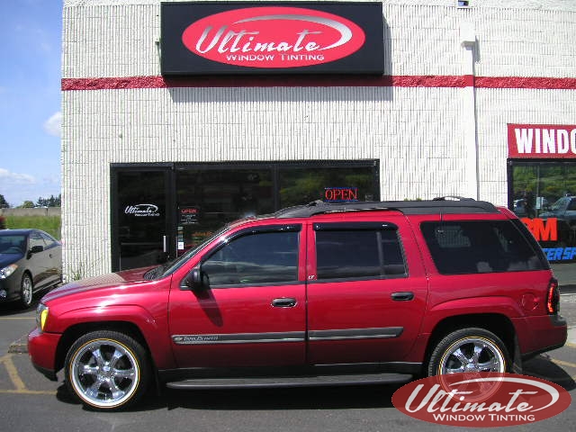 red trail blazer with windows tinted