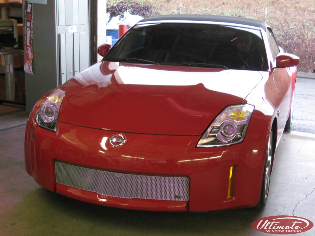 red nissan getting ppf installed