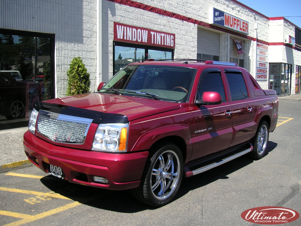 red cadillac escalade with window tint